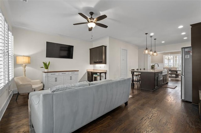 living room featuring dark wood-type flooring and ceiling fan