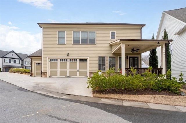 view of front of house featuring ceiling fan, a porch, and a garage