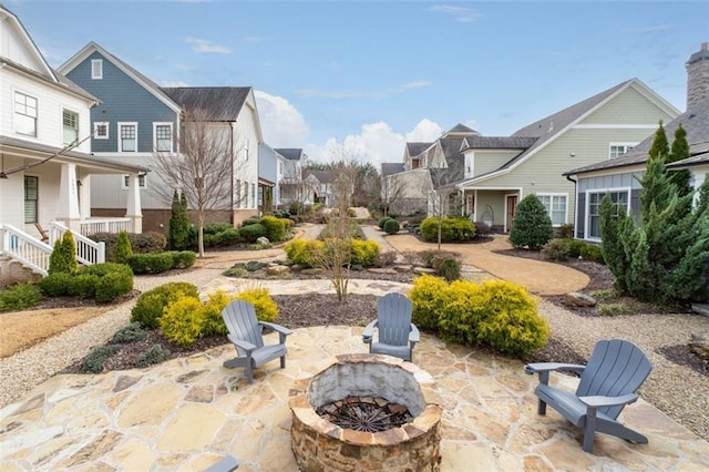 exterior space featuring a patio area and an outdoor fire pit