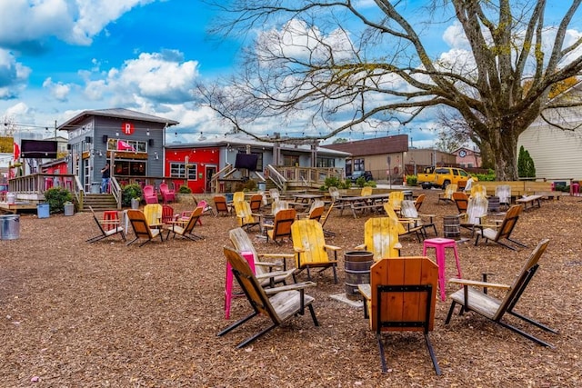 exterior space featuring an outdoor fire pit