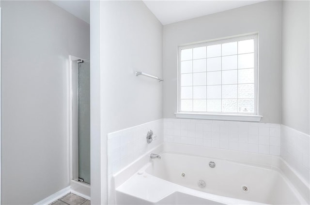 4041 Ash Tree St, Snellville, GA 30039 - full bathroom with plenty of natural light, a jetted tub, and a shower stall