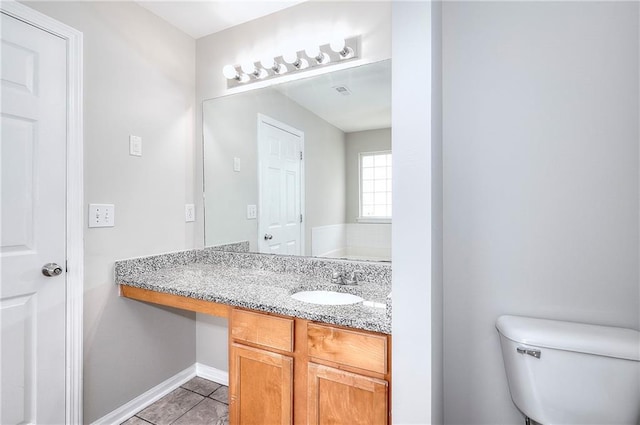 4041 Ash Tree St, Snellville, GA 30039 - bathroom with tile patterned flooring, vanity, toilet, and baseboards