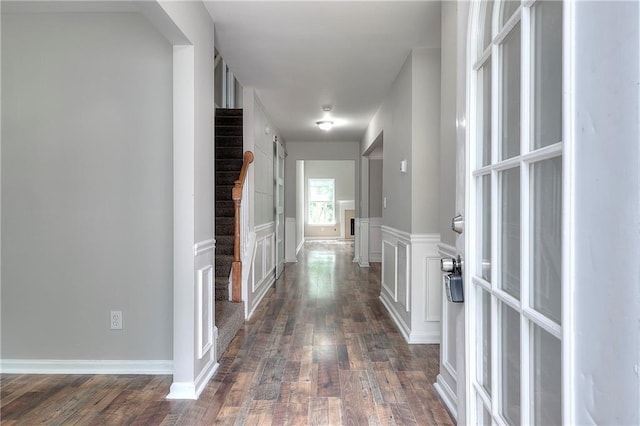 4041 Ash Tree St, Snellville, GA 30039 - corridor with dark wood-style floors, a wainscoted wall, and a decorative wall