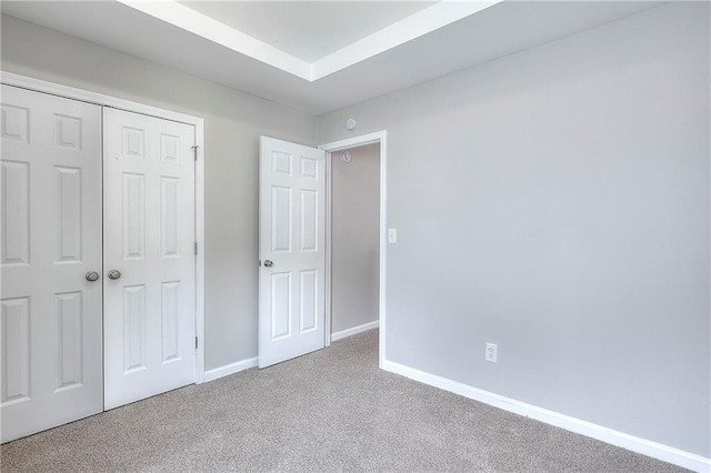 4041 Ash Tree St, Snellville, GA 30039 - unfurnished bedroom featuring carpet flooring, baseboards, and a closet
