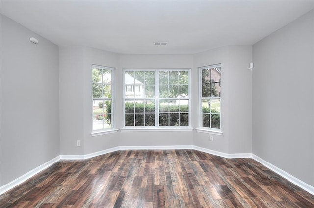 4041 Ash Tree St, Snellville, GA 30039 - spare room featuring dark wood-type flooring and baseboards