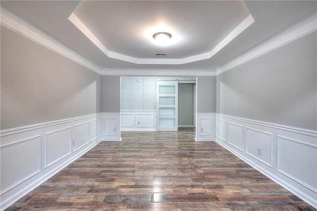 4041 Ash Tree St, Snellville, GA 30039 - spare room with a raised ceiling, a decorative wall, a wainscoted wall, dark wood finished floors, and ornamental molding