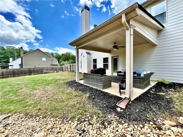 view of yard featuring an outdoor hangout area, a ceiling fan, and a patio