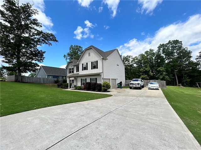 view of front of house featuring board and batten siding, concrete driveway, and an attached garage