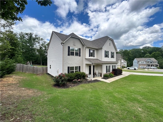 view of front of house with board and batten siding and a shingled roof