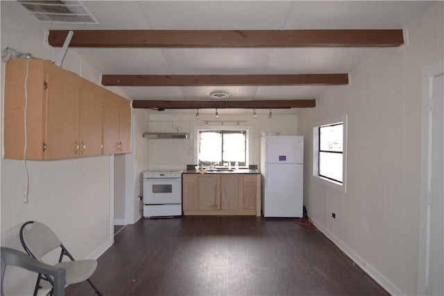 kitchen featuring a healthy amount of sunlight, white appliances, a sink, and beam ceiling