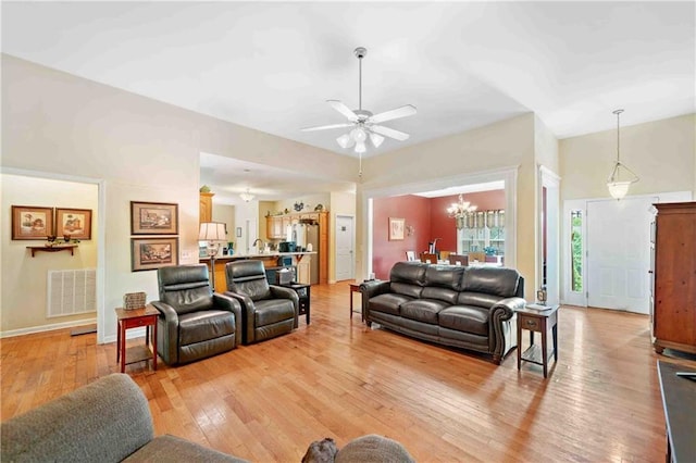 250 Brianna Blvd, Calhoun, GA 30701 - living room with a chandelier, light wood-style flooring, and a ceiling fan