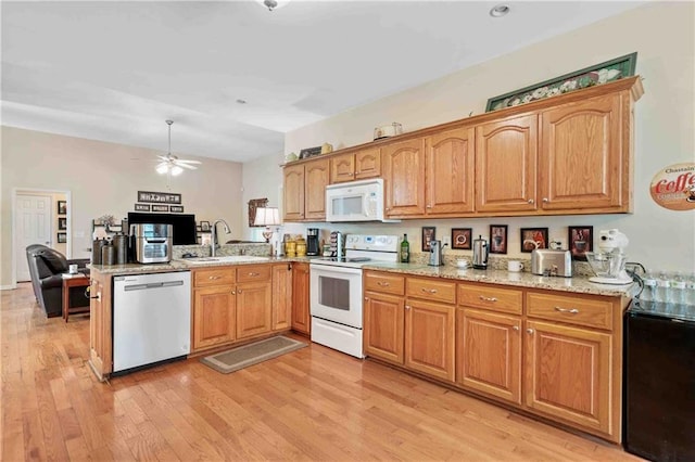 250 Brianna Blvd, Calhoun, GA 30701 - kitchen with white appliances, ceiling fan, light wood-style floors, a peninsula, and light stone counters