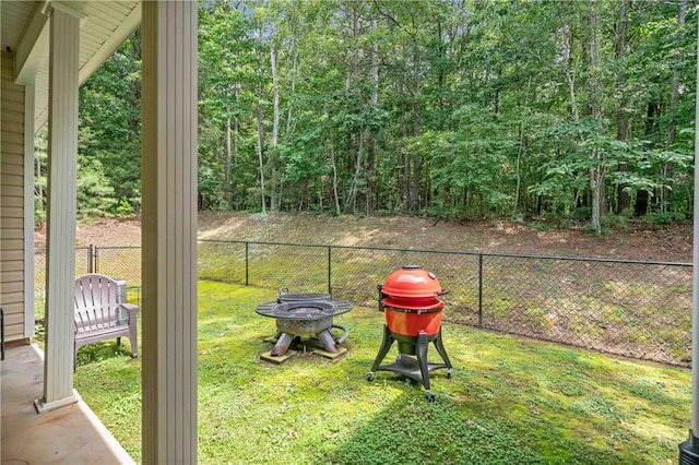 250 Brianna Blvd, Calhoun, GA 30701 - view of yard featuring an outdoor fire pit and a wooded view