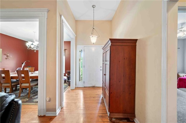 250 Brianna Blvd, Calhoun, GA 30701 - entrance foyer with light wood-style floors and a chandelier
