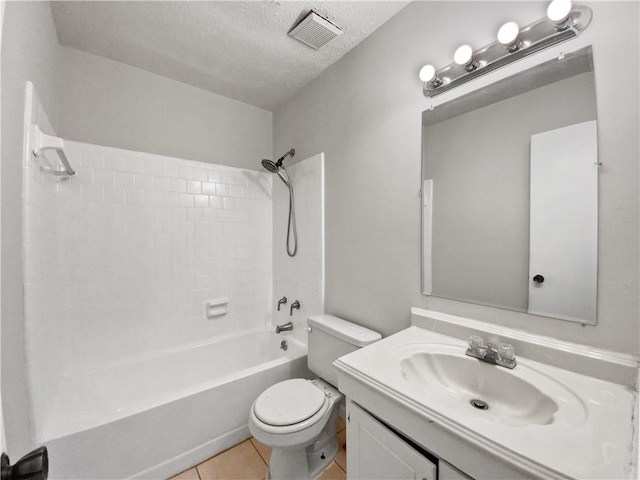 full bathroom featuring tile patterned floors, a textured ceiling, vanity, shower / bathing tub combination, and toilet