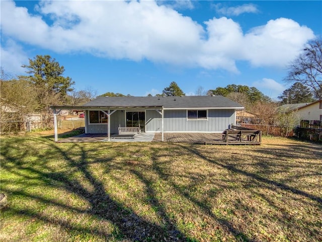 back of property featuring a lawn and a patio