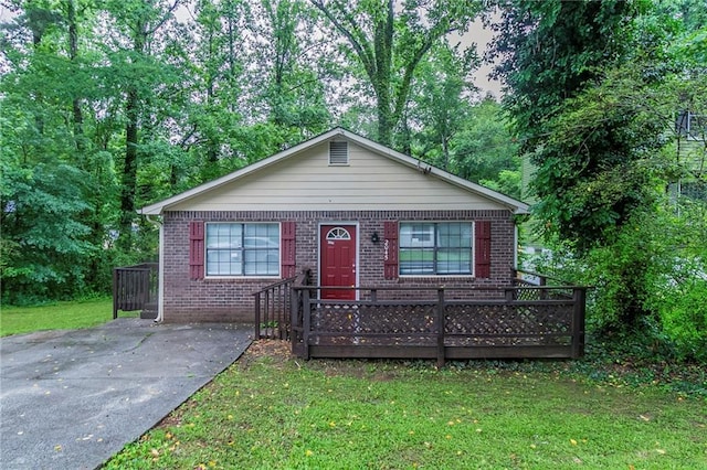 2045 Scarbrough Dr, Stone Mountain, GA 30088 - view of front of house with a front yard and brick siding