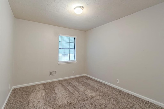 2045 Scarbrough Dr, Stone Mountain, GA 30088 - spare room with carpet, baseboards, and a textured ceiling