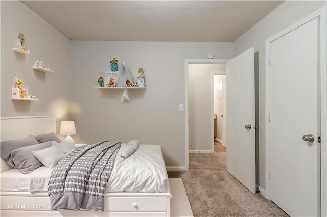 2045 Scarbrough Dr, Stone Mountain, GA 30088 - bedroom featuring light colored carpet and baseboards