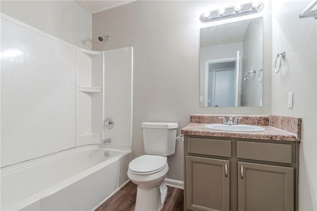 2045 Scarbrough Dr, Stone Mountain, GA 30088 - bathroom featuring toilet, shower / bath combination, vanity, and wood finished floors