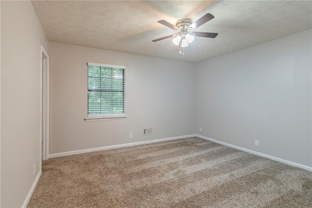 2045 Scarbrough Dr, Stone Mountain, GA 30088 - empty room featuring carpet floors, a ceiling fan, a textured ceiling, and baseboards