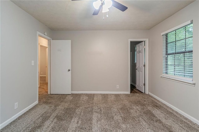 2045 Scarbrough Dr, Stone Mountain, GA 30088 - carpeted empty room with a ceiling fan and baseboards