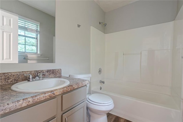 2045 Scarbrough Dr, Stone Mountain, GA 30088 - full bathroom with vanity, shower / washtub combination, toilet, and wood finished floors
