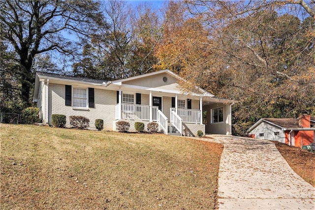 view of front of home with a porch and a front lawn