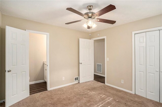 896 Meadow Rock Way, Stone Mountain, GA 30083 - unfurnished bedroom featuring ceiling fan, a closet, and carpet