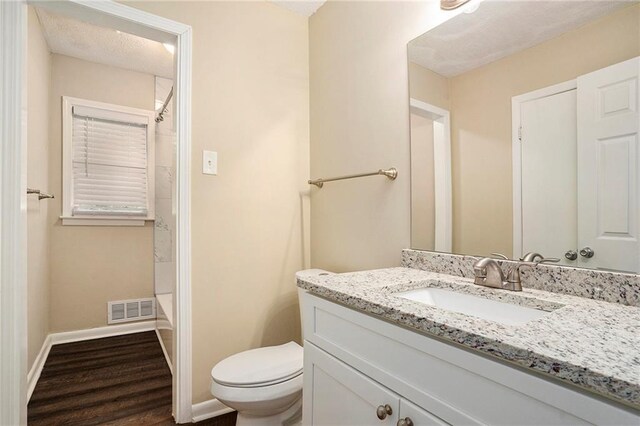 896 Meadow Rock Way, Stone Mountain, GA 30083 - bathroom with hardwood / wood-style floors, vanity, and toilet
