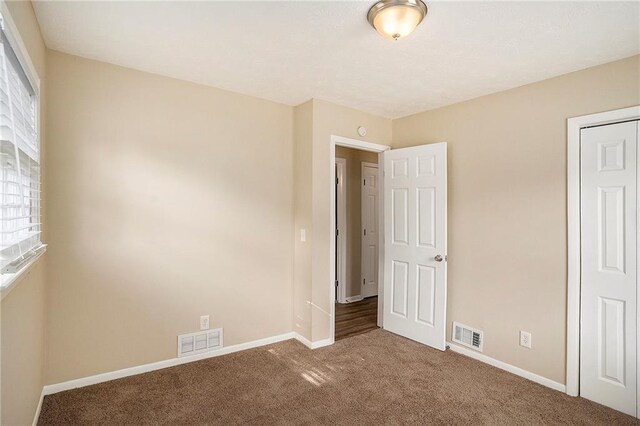 896 Meadow Rock Way, Stone Mountain, GA 30083 - unfurnished bedroom with carpet flooring and a closet