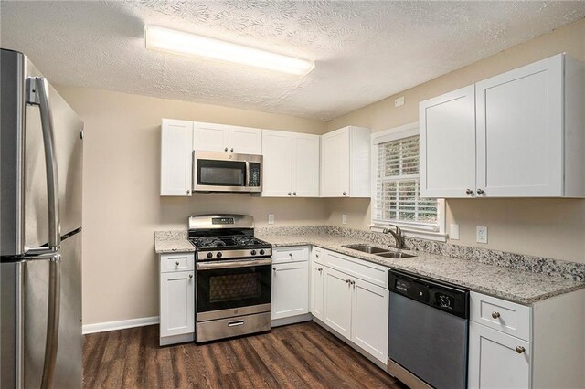 896 Meadow Rock Way, Stone Mountain, GA 30083 - kitchen with stainless steel appliances, white cabinetry, dark hardwood / wood-style floors, and sink