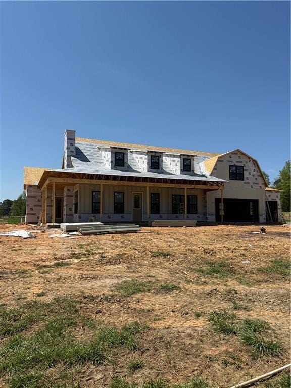 view of front of home featuring a chimney