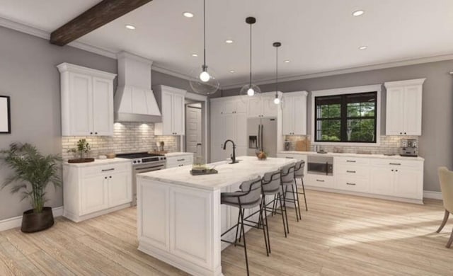 kitchen featuring a sink, tasteful backsplash, a kitchen bar, custom range hood, and appliances with stainless steel finishes
