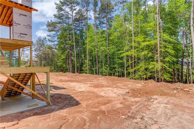 2675 Drayton Hall Dr, Buford, GA 30519 - view of yard featuring a water view, fence, and a wooded view