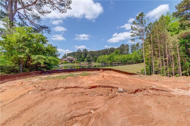 2675 Drayton Hall Dr, Buford, GA 30519 - view of yard with a water view, fence, and a wooded view