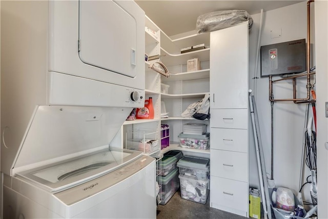 laundry area featuring stacked washer and clothes dryer