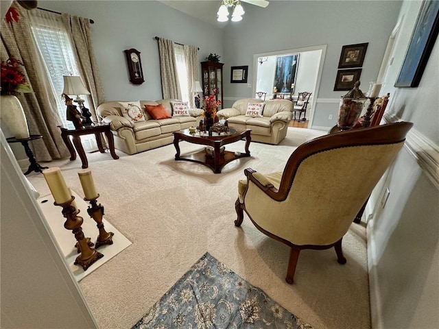 living room featuring carpet flooring and ceiling fan