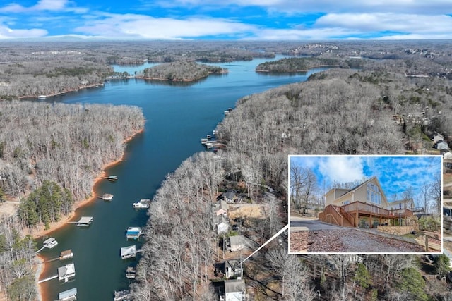 birds eye view of property with a water view