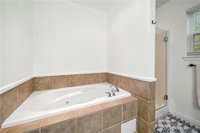 bathroom with a jetted tub and a shower stall