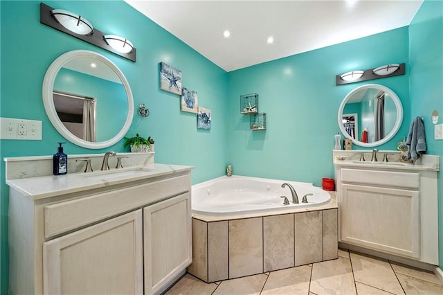 bathroom with two vanities, a sink, a bath, and tile patterned floors