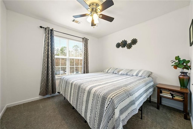 carpeted bedroom with baseboards, visible vents, and ceiling fan