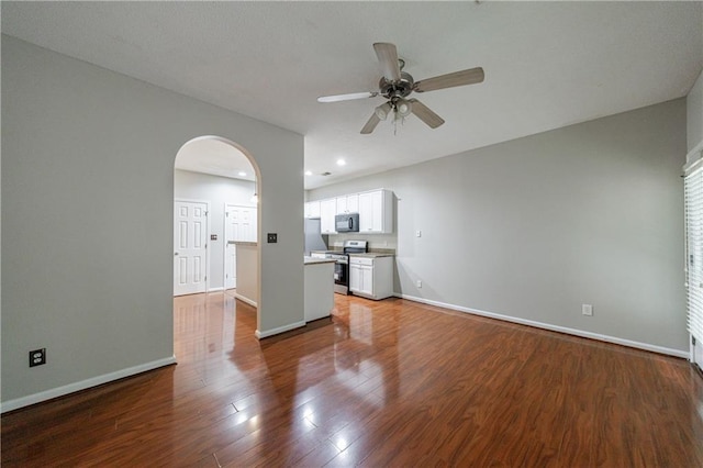 4844 W Park Cir Unit 4844, College Park, GA 30349 - unfurnished living room with ceiling fan, arched walkways, and baseboards