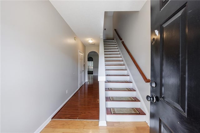 4844 W Park Cir Unit 4844, College Park, GA 30349 - stairs with arched walkways, wood finished floors, and baseboards