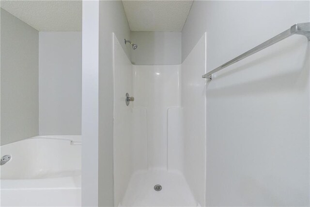 4844 W Park Cir Unit 4844, College Park, GA 30349 - full bath featuring a textured ceiling, a garden tub, and a shower