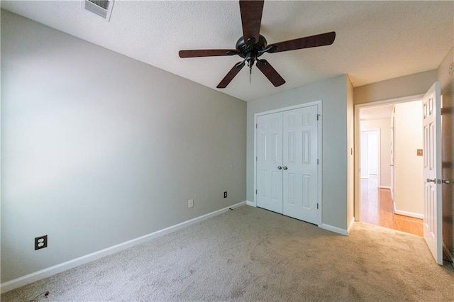 4844 W Park Cir Unit 4844, College Park, GA 30349 - unfurnished bedroom featuring carpet, baseboards, a closet, and a ceiling fan