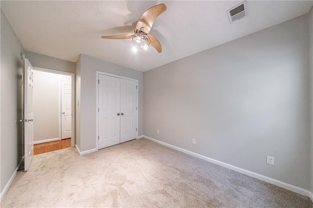 4844 W Park Cir Unit 4844, College Park, GA 30349 - unfurnished bedroom with carpet, baseboards, a closet, and a ceiling fan