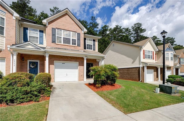 4844 W Park Cir Unit 4844, College Park, GA 30349 - view of front of home with brick siding, an attached garage, concrete driveway, and a front lawn