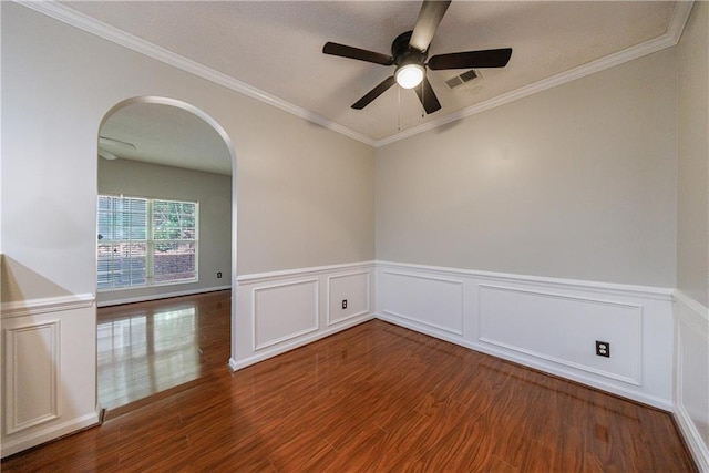 4844 W Park Cir Unit 4844, College Park, GA 30349 - spare room featuring arched walkways, wood finished floors, a ceiling fan, a wainscoted wall, and ornamental molding