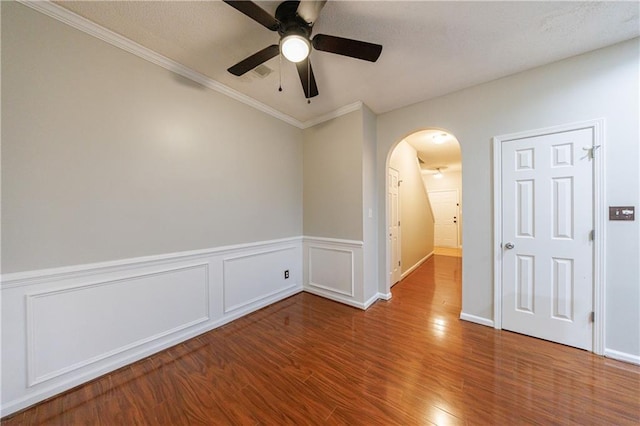 4844 W Park Cir Unit 4844, College Park, GA 30349 - spare room featuring ceiling fan, arched walkways, wood finished floors, ornamental molding, and wainscoting